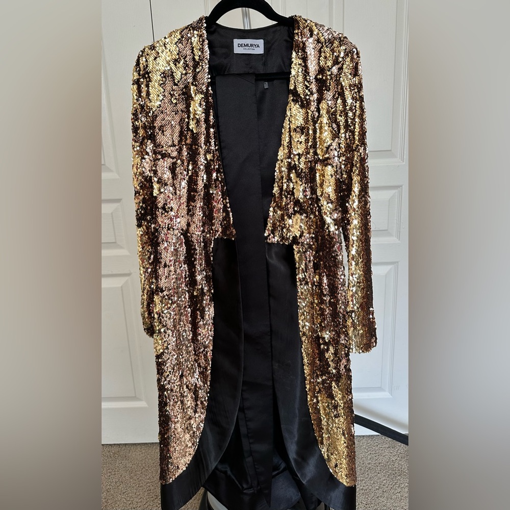 Gold sequence robe dress with black silk belt matching the black piping.